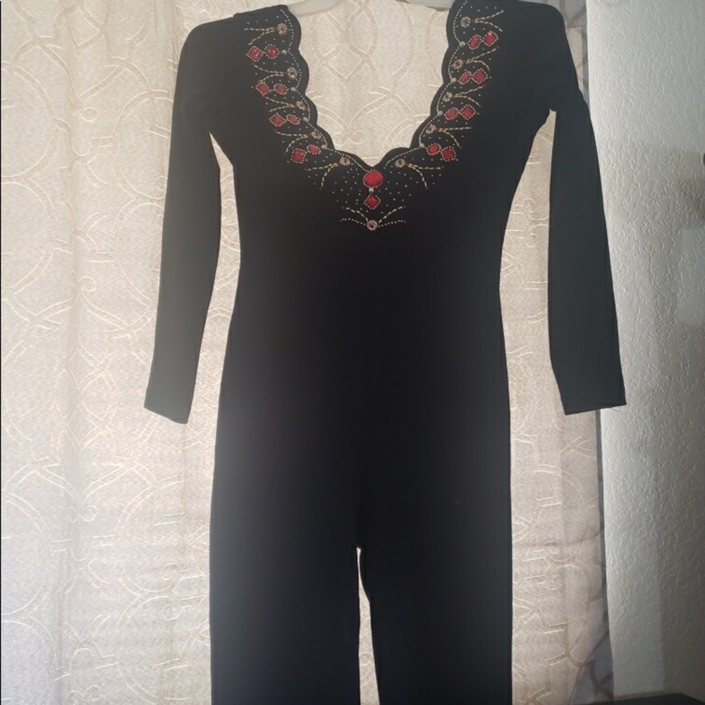 Black jumpsuit with low V neck  gold & red studs